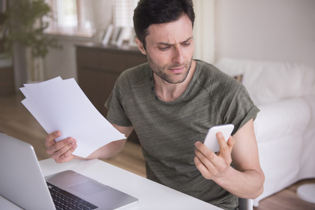 young man working home with his laptop